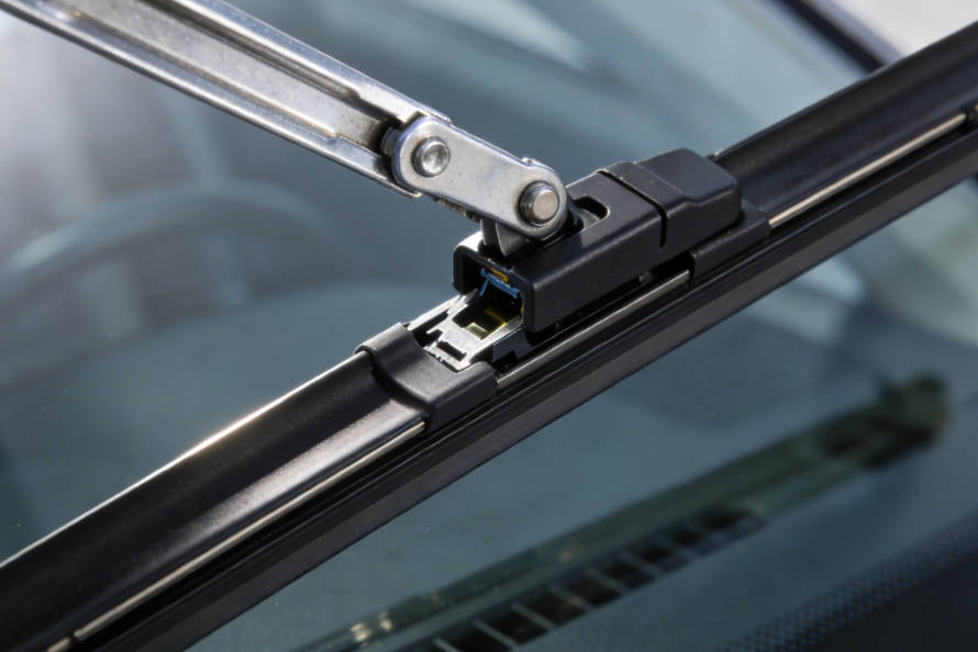 Slide the new blade onto the arm until it clicks into place