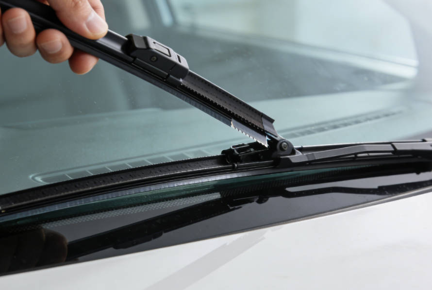 Gently lower the wiper arm back to the windshield